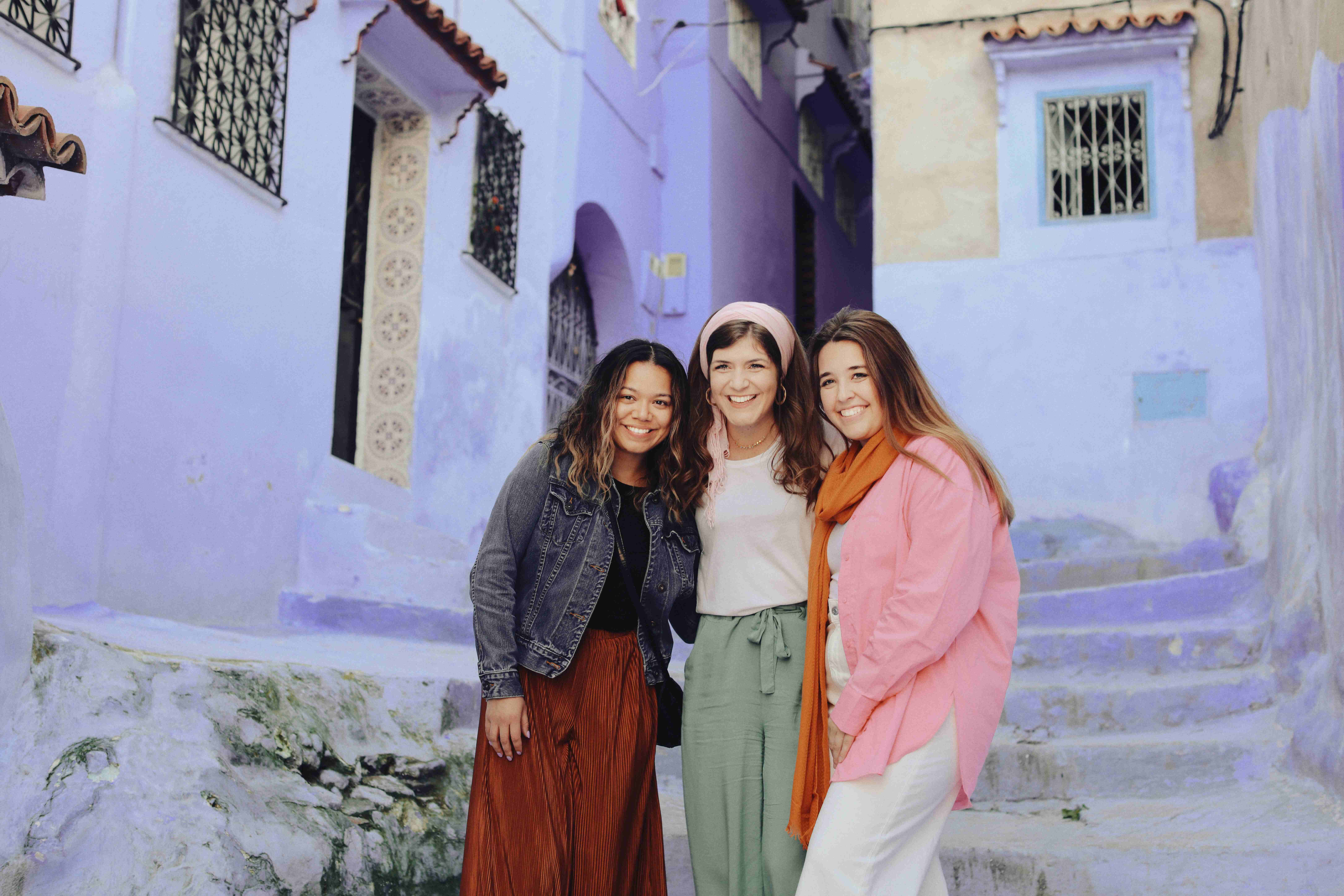 Three Women wearing Modest clothes in the blue city of morocco Chefchoune